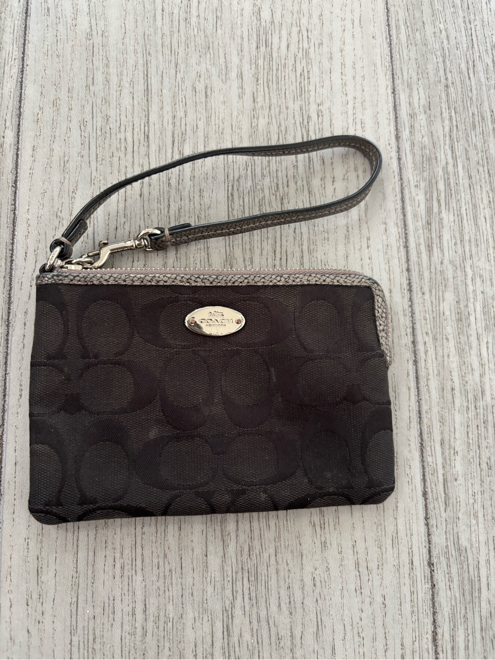 Coach jacquard wristlet in black. GUC.